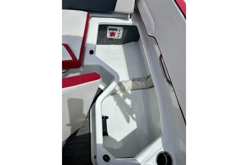 Slide: The Image of Interior view of 2021 Scarab 195 ID boat, featuring red and white seating. - 33