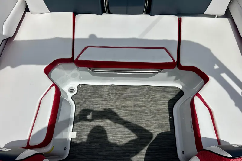 Slide: The Image of Interior seating of 2021 Scarab 195 ID boat with red and white upholstery. - 34