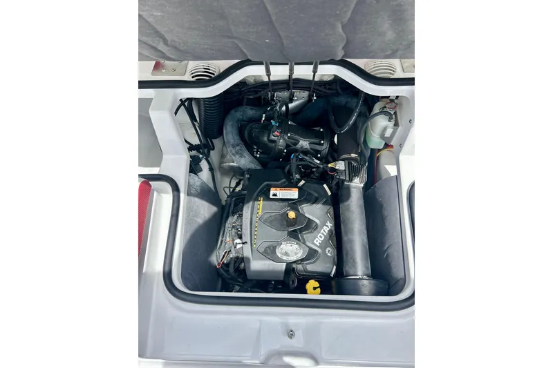 Slide: The Image of Engine compartment of 2021 Scarab 195 ID boat featuring a Rotax engine. - 35