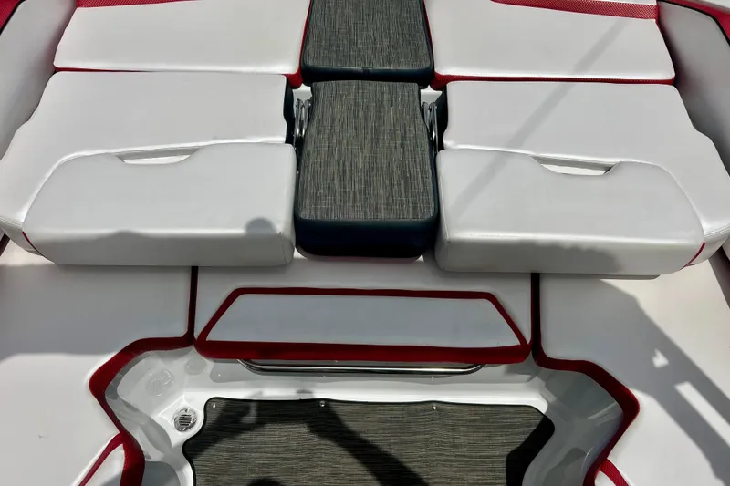 Slide: The Image of 2021 Scarab 195 ID boat interior with white and red cushioned seating. - 39