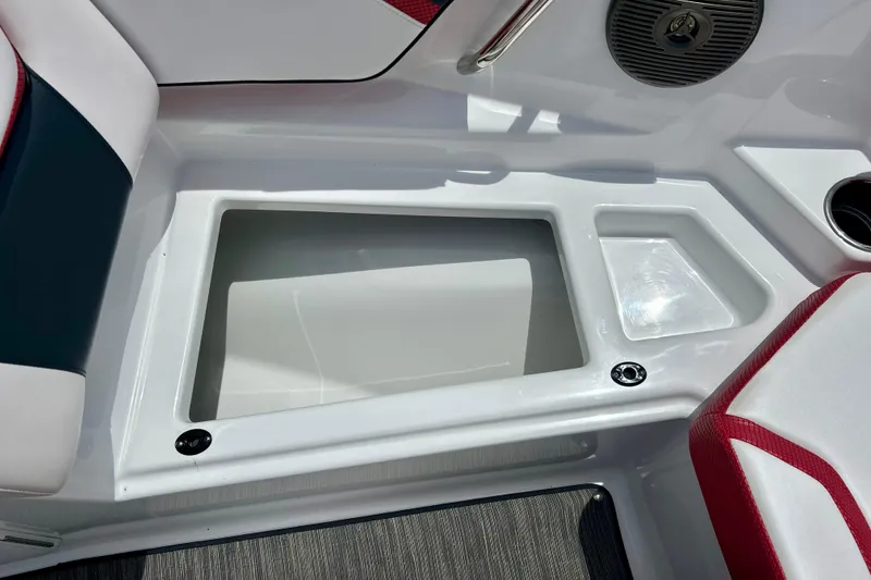 Slide: The Image of Interior view of a 2021 Scarab 195 ID boat, featuring seating and storage compartments. - 41