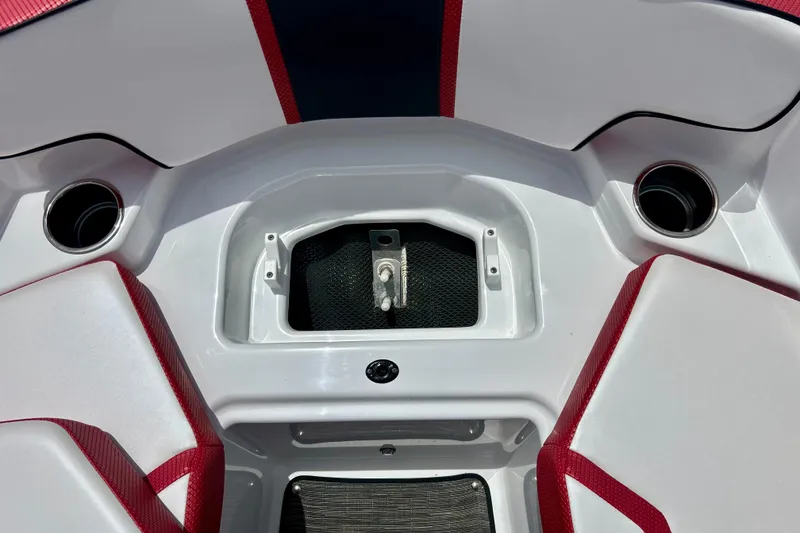 Slide: The Image of Interior of 2021 Scarab 195 ID boat with red and white seating and storage compartment. - 42
