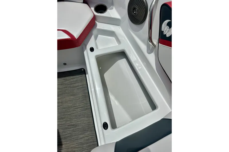Slide: The Image of Interior of 2021 Scarab 195 ID boat featuring storage compartment and seating area. - 44