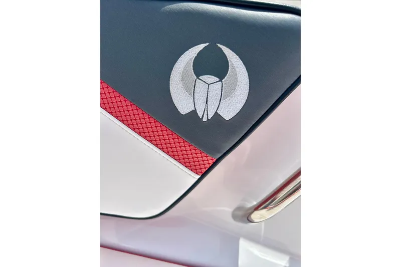 Slide: The Image of Close-up of 2021 Scarab 195 ID boat seat with logo and red accent. - 46