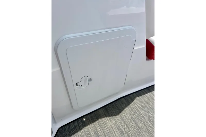 Slide: The Image of Access panel on 2021 Scarab 195 ID boat, featuring sleek white design. - 51