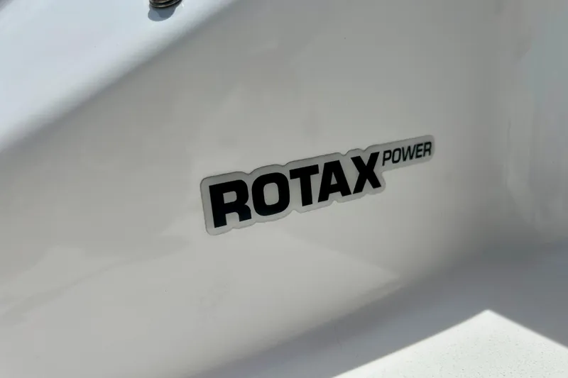 Slide: The Image of Rotax Power logo on 2021 Scarab 195 ID boat exterior. - 54