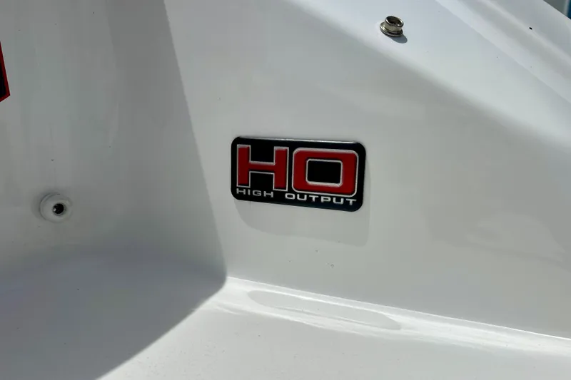 Slide: The Image of 2021 Scarab 195 ID boat with "High Output" emblem on white surface. - 55