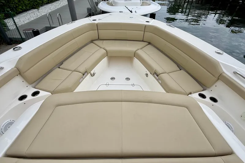Slide: The Image of Luxurious seating area on a 2018 Pursuit S 408 Sport boat, dockside view. - 66