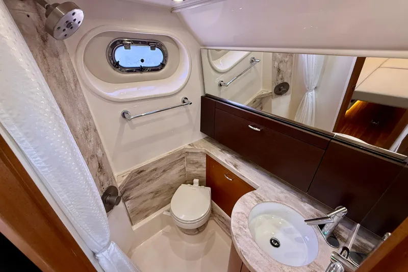 Slide: The Image of Luxurious bathroom in 2018 Pursuit S 408 Sport boat with modern fixtures and porthole window. - 86