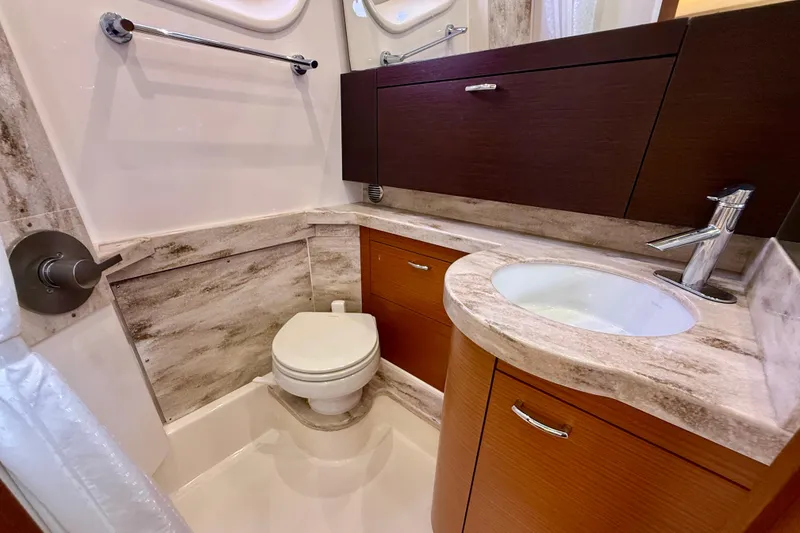 Slide: The Image of Luxurious bathroom in 2018 Pursuit S 408 Sport boat with modern fixtures and marble accents. - 87