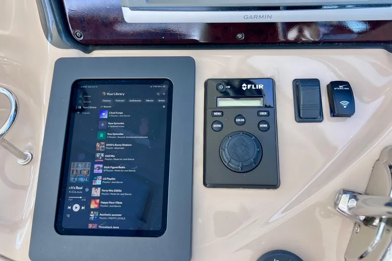 Slide: The Image of Control panel of a 2004 Sea Ray 500 Sundancer with touchscreen and FLIR system. - 16