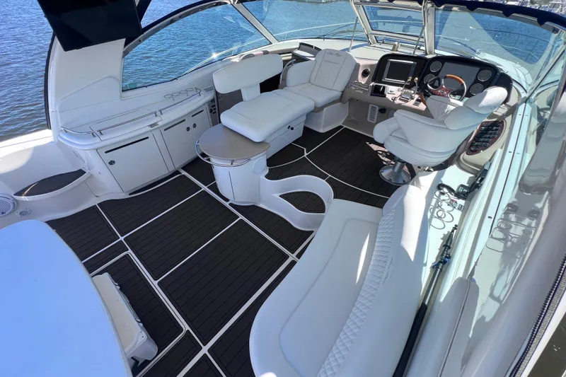 Slide: The Image of Luxurious 2004 Sea Ray 500 Sundancer yacht interior with elegant seating and modern dashboard. - 20