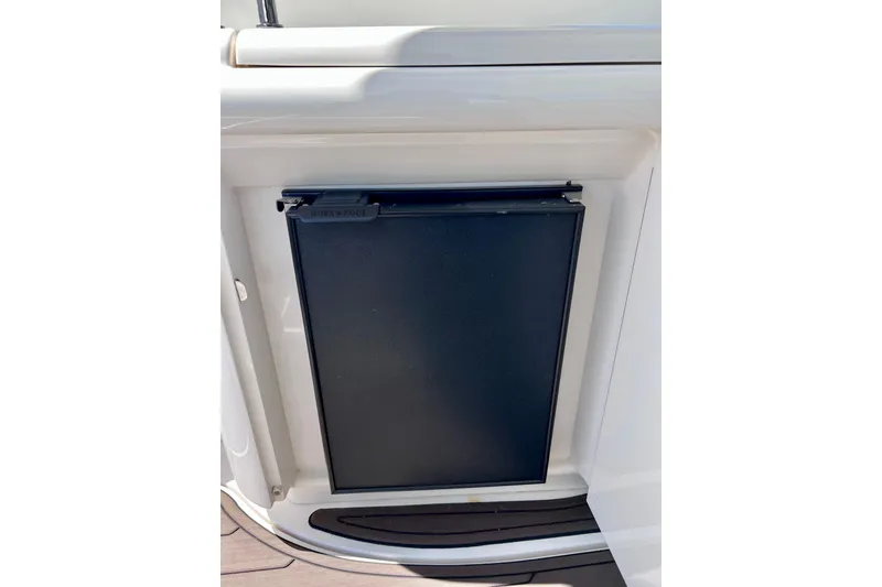Slide: The Image of Black panel on 2004 Sea Ray 500 Sundancer yacht, integrated into white cabinetry. - 24