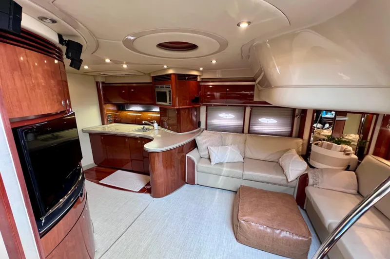 Slide: The Image of Luxurious interior of a 2004 Sea Ray 500 Sundancer yacht with modern kitchen and cozy seating. - 25