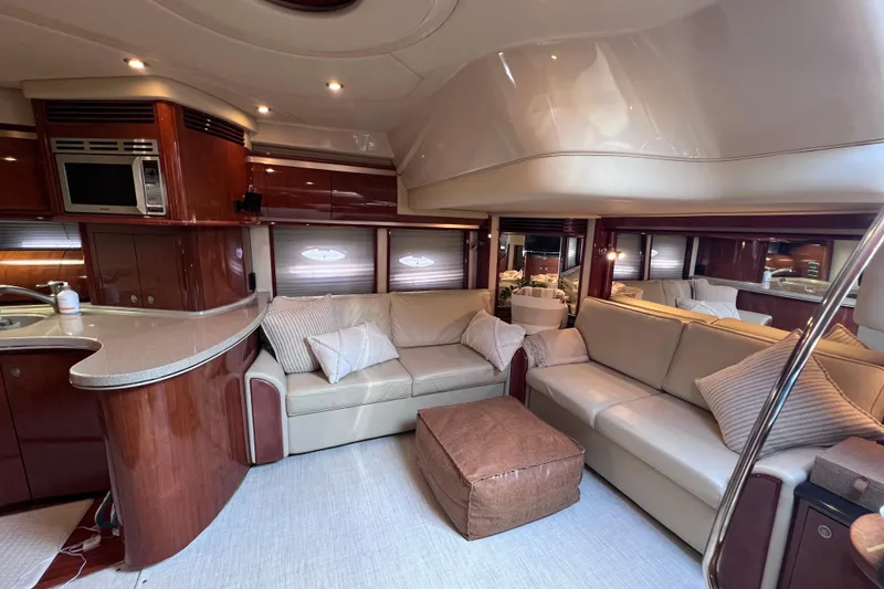 Slide: The Image of Luxurious interior of a 2004 Sea Ray 500 Sundancer yacht with elegant seating and modern amenities. - 26
