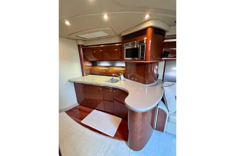 Slide: The Image of Luxurious 2004 Sea Ray 500 Sundancer yacht interior kitchen with modern amenities. - 28