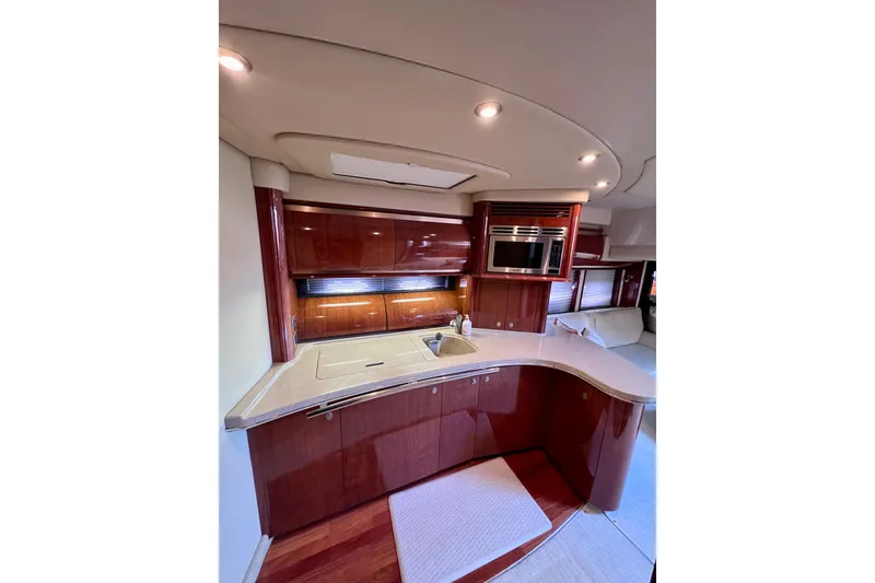 Slide: The Image of Luxurious 2004 Sea Ray 500 Sundancer yacht interior with modern kitchen amenities. - 29