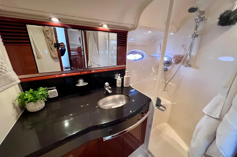 Slide: The Image of Luxurious bathroom in 2004 Sea Ray 500 Sundancer yacht with modern fixtures and elegant design. - 36
