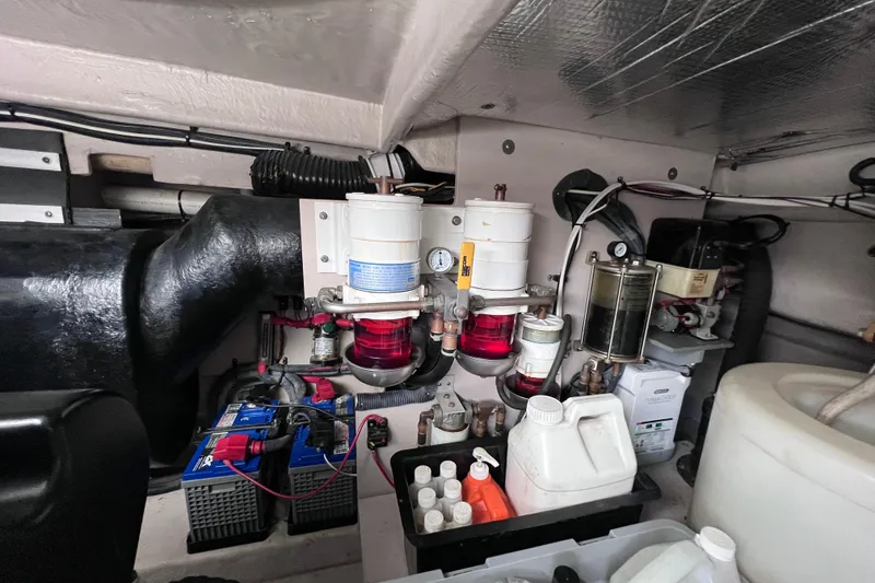 Slide: The Image of Engine room of a 2004 Sea Ray 500 Sundancer with fuel filters and batteries. - 39