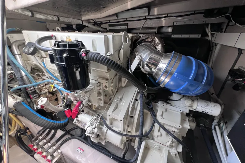 Slide: The Image of Engine compartment of a 2004 Sea Ray 500 Sundancer, showcasing detailed mechanical components. - 41
