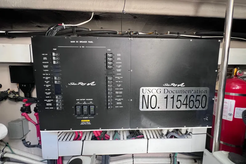 Slide: The Image of Main breaker panel of 2004 Sea Ray 500 Sundancer with USCG documentation number. - 42