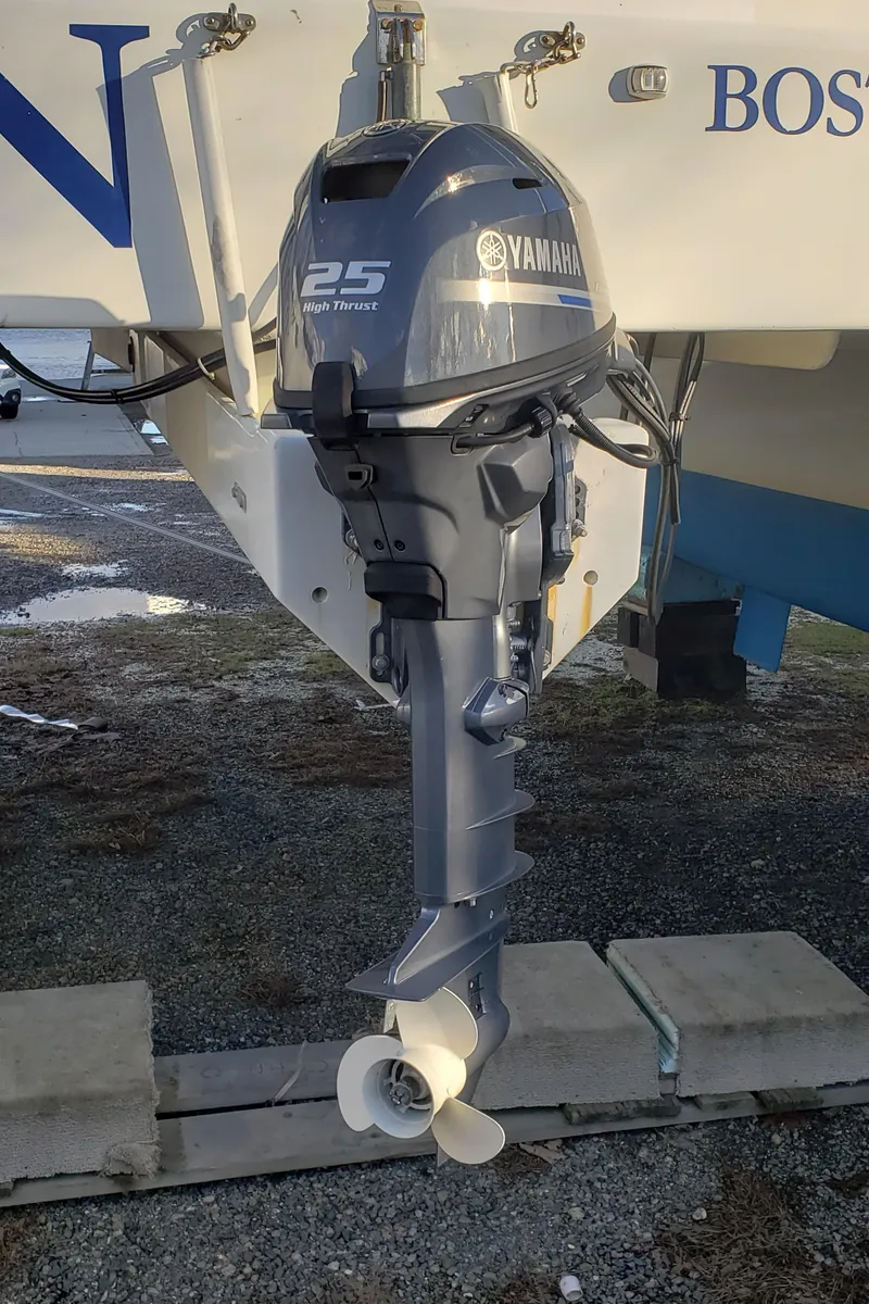 Slide: The Image of Yamaha 25 horsepower outboard motor on 2000 Crowther Catamaran. - 12