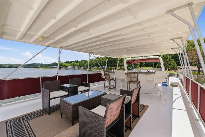Slide: The Image of Spacious upper deck of 2002 Sumerset 16x75 houseboat with seating and scenic lake view. - 33
