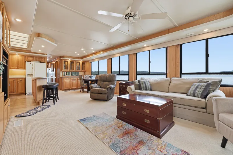 Slide: The Image of Luxurious interior of 2002 Sumerset 16x75 houseboat with spacious living area and panoramic windows. - 48