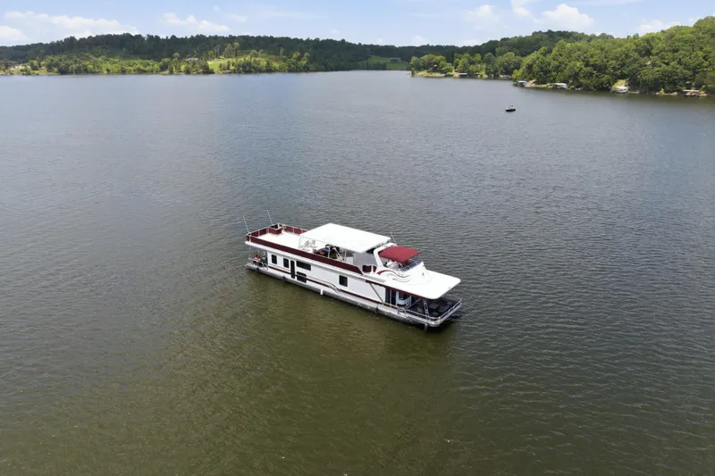 Slide: The Image of Aerial view of 2002 Sumerset 16x75 houseboat on a serene lake. - 14