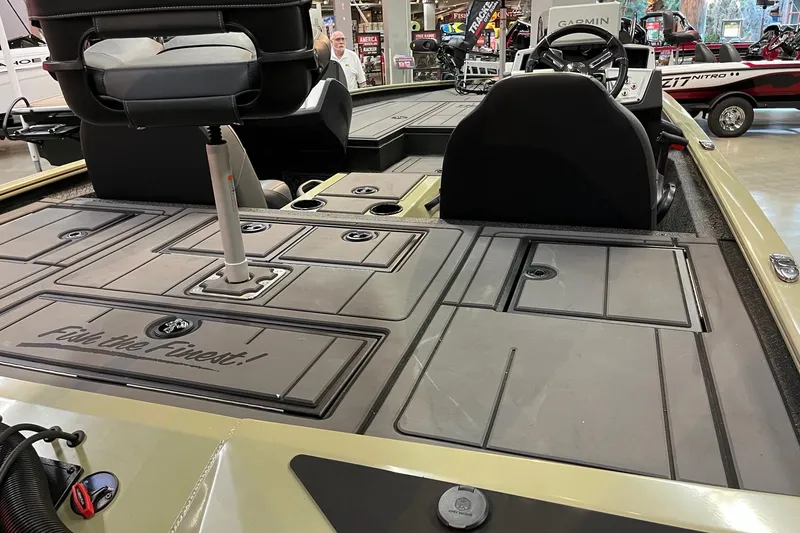 Slide: The Image of 2026 Tracker Savage 215 boat interior with seating and storage compartments. - 5