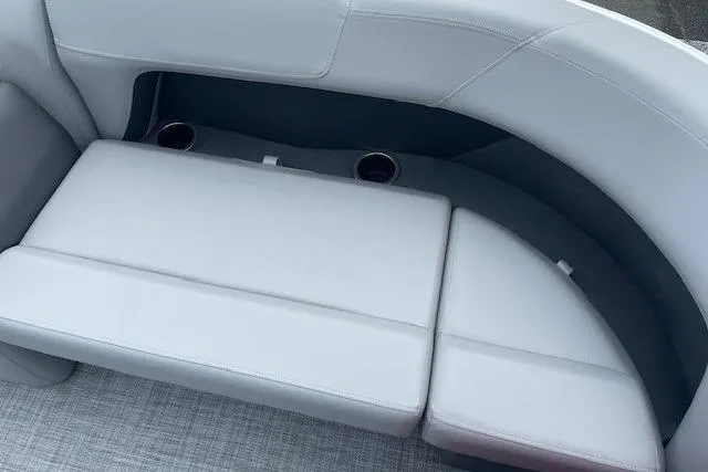Slide: The Image of Sun Tracker Party Barge 18 DLX 2026 interior seating with cup holders. - 15