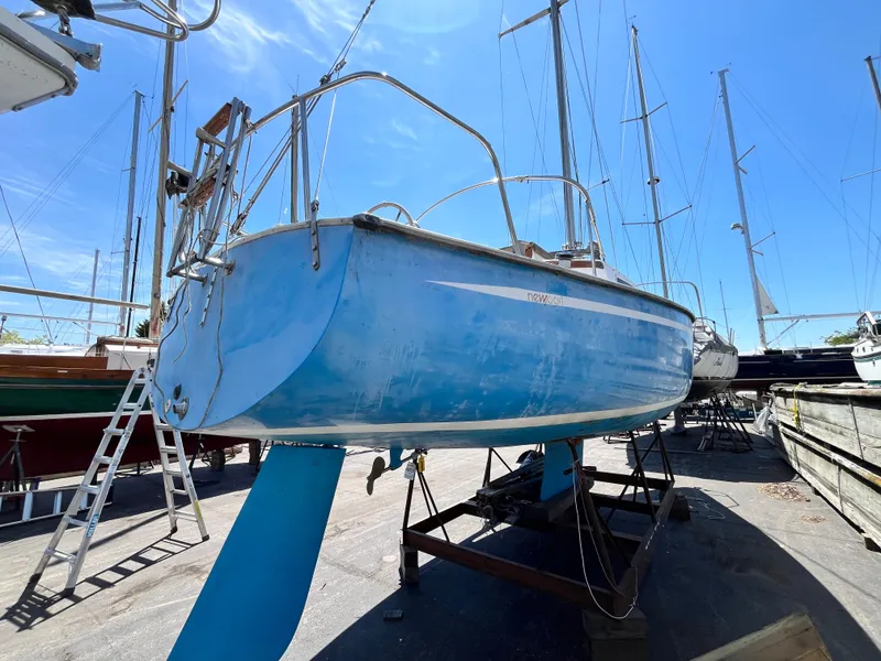 Slide: The Image of 1974 Capital Newport 30 MKII sailboat on a dry dock. - 2