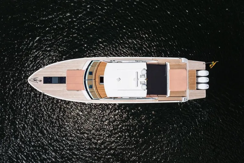Slide: The Image of Aerial view of 2023 Delta Powerboats 60 Open yacht on dark water. - 15
