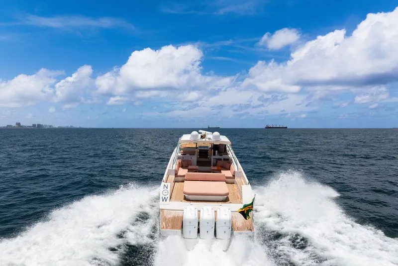 Slide: The Image of 2023 Delta Powerboats 60 Open cruising on open sea under blue sky. - 17