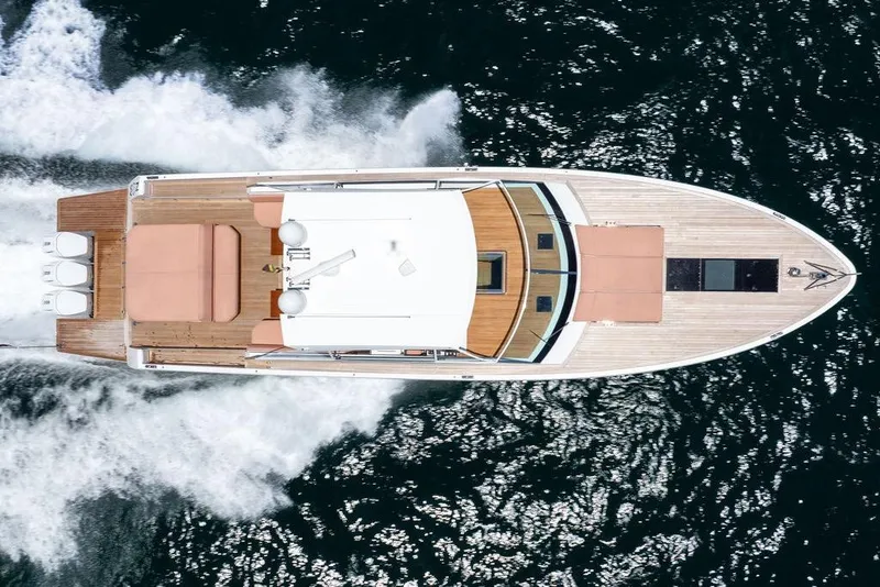 Slide: The Image of Aerial view of 2023 Delta Powerboats 60 Open cruising on water. - 22