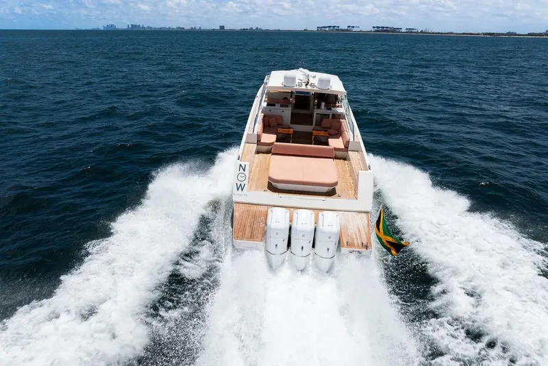 Slide: The Image of 2023 Delta Powerboats 60 Open cruising on open water, rear view. - 23