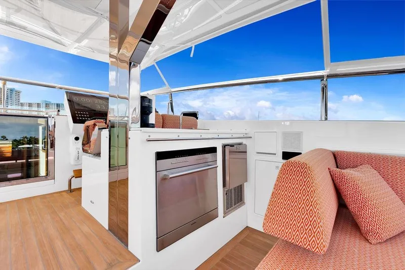 Slide: The Image of Luxurious interior of 2023 Delta Powerboats 60 Open with modern seating and navigation equipment. - 29