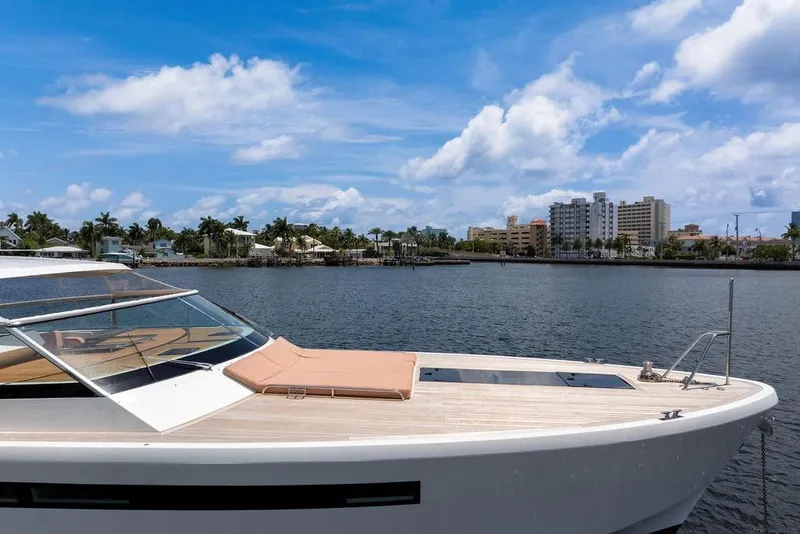 Slide: The Image of 2023 Delta Powerboats 60 Open yacht on a sunny waterfront with city skyline. - 3