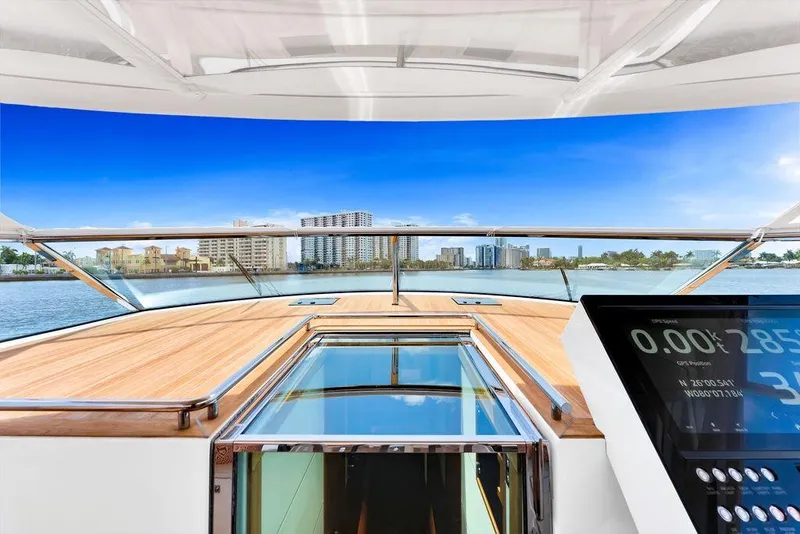 Slide: The Image of 2023 Delta Powerboats 60 Open yacht with city skyline view and modern dashboard. - 44