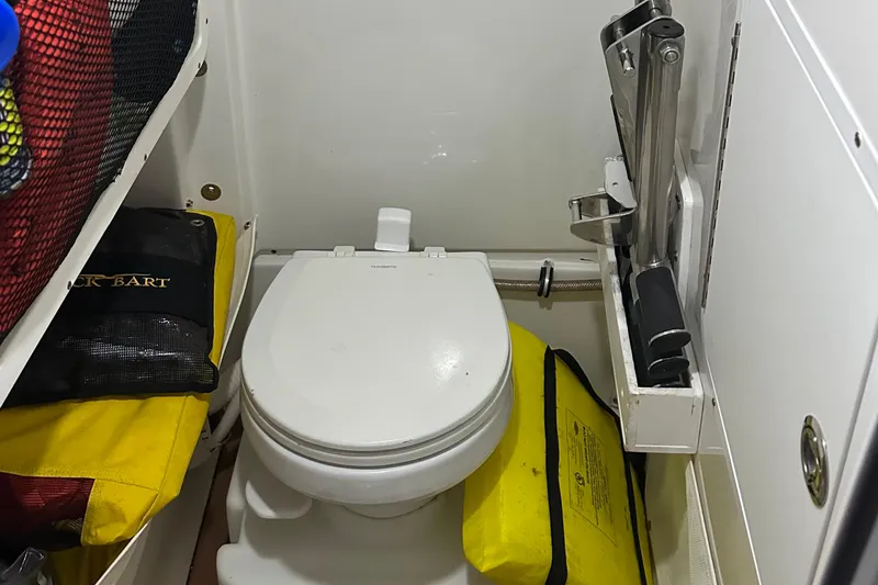 Slide: The Image of Compact marine toilet in 2019 Sea Hunt Gamefish 25 boat cabin. - 11