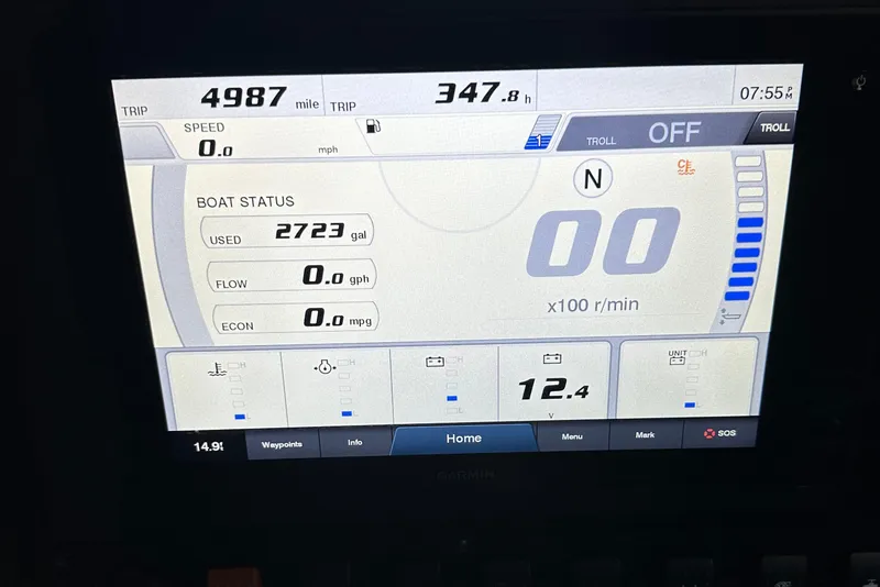 Slide: The Image of Dashboard display of a 2019 Sea Hunt Gamefish 25 boat showing trip data and fuel status. - 13