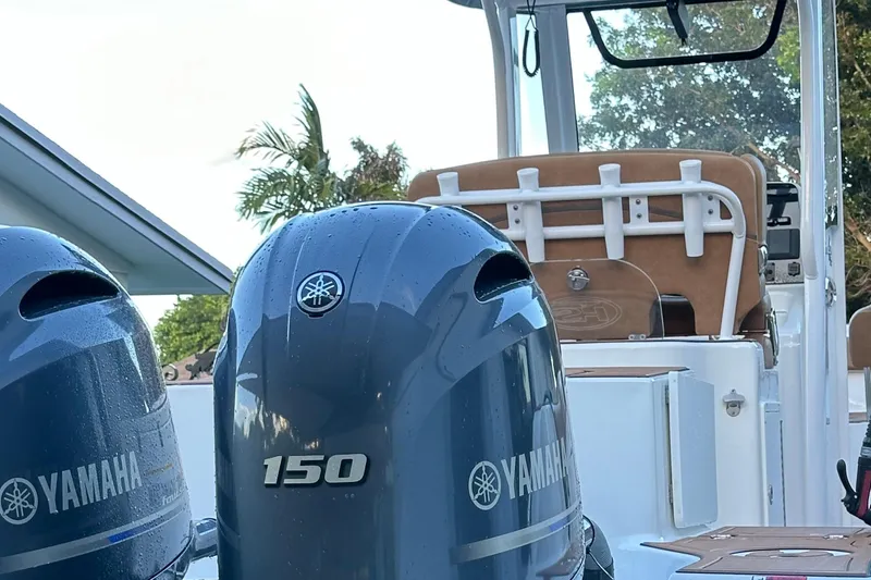 Slide: The Image of 2019 Sea Hunt Gamefish 25 with Yamaha 150 engines, featuring a sleek design. - 15