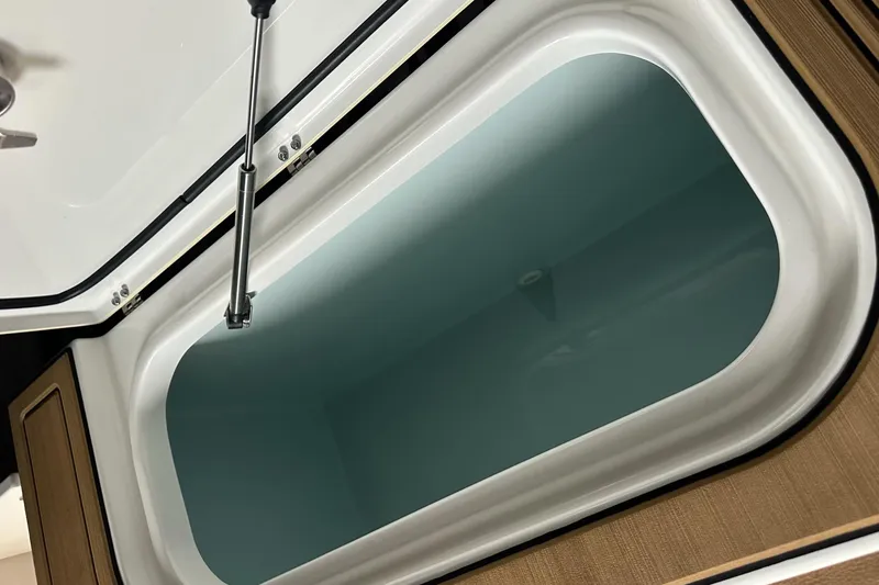 Slide: The Image of Open storage compartment on a 2019 Sea Hunt Gamefish 25 boat. - 6