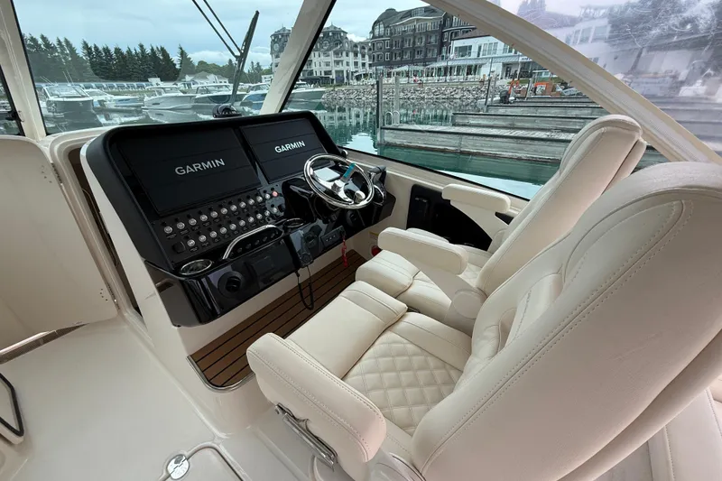 Slide: The Image of Interior of 2025 Grady-White Freedom 345 boat with Garmin navigation system and luxurious seating. - 18