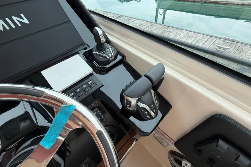 Slide: The Image of Helm controls of 2025 Grady-White Freedom 345 boat with Yamaha and Garmin systems. - 20