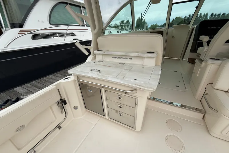 Slide: The Image of 2025 Grady-White Freedom 345 boat interior with sleek cabinetry and seating. - 22