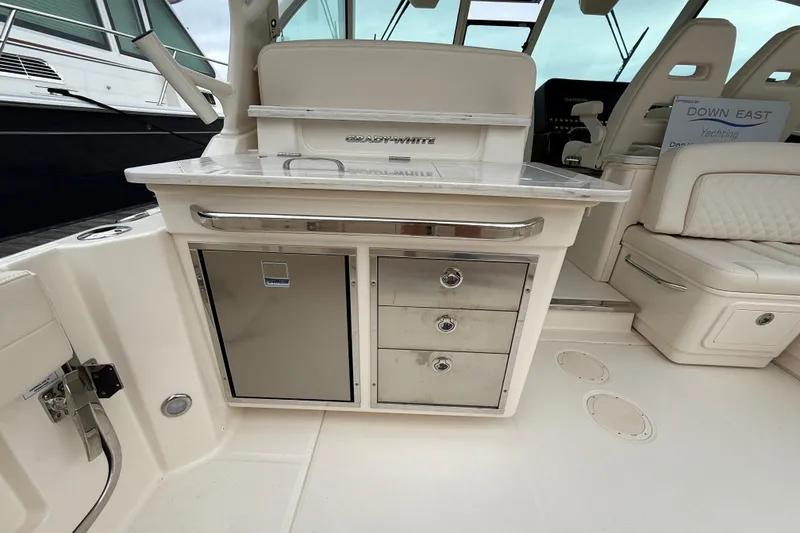 Slide: The Image of 2025 Grady-White Freedom 345 boat interior with storage drawers and seating area. - 23