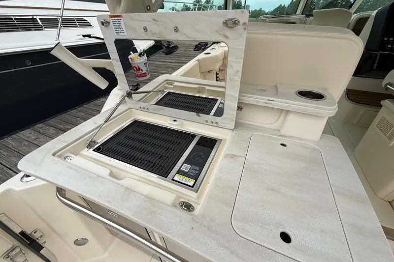 Slide: The Image of Outdoor grill station on 2025 Grady-White Freedom 345 boat, featuring sleek design and functionality. - 26