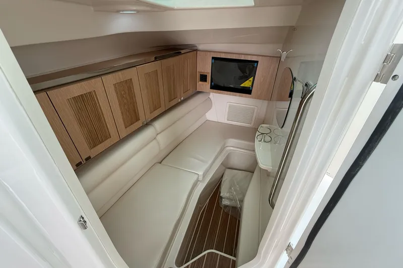 Slide: The Image of Luxurious interior of 2025 Grady-White Freedom 345 boat with wood accents and seating. - 27