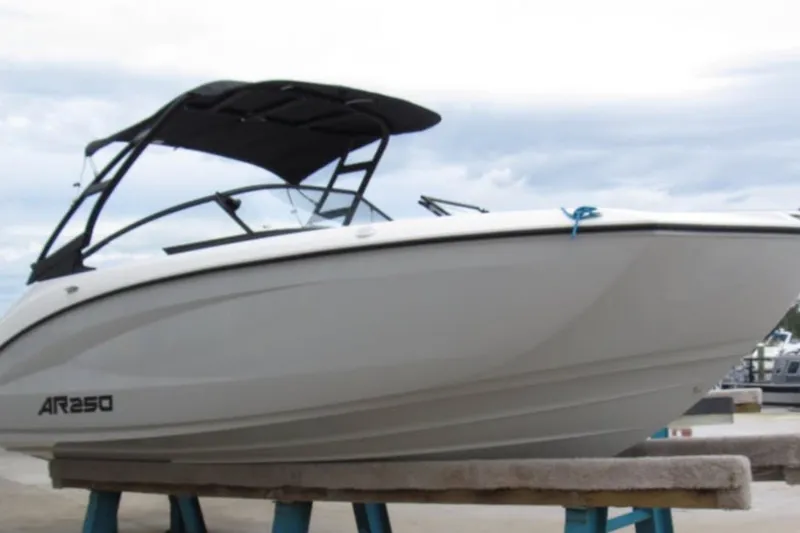 Slide: The Image of 2024 Yamaha Boats AR250 on display, featuring sleek design and modern canopy. - 2